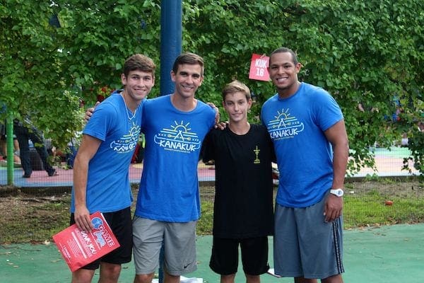 Our oldest with his college camp counselors last summer!