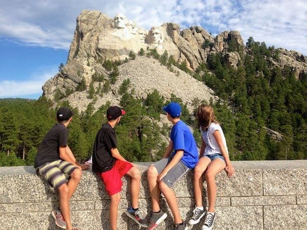 Kids looking at Mount Rushmore National Monument in Black Hills, South Dakota